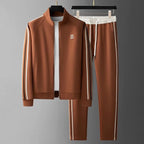 Chestnut brown tracksuit on hangers showing full-length zip jacket with striped sleeves and matching striped joggers