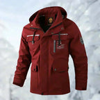 Close-up front angle of the black jacket showing the branded neck label and checked hood lining