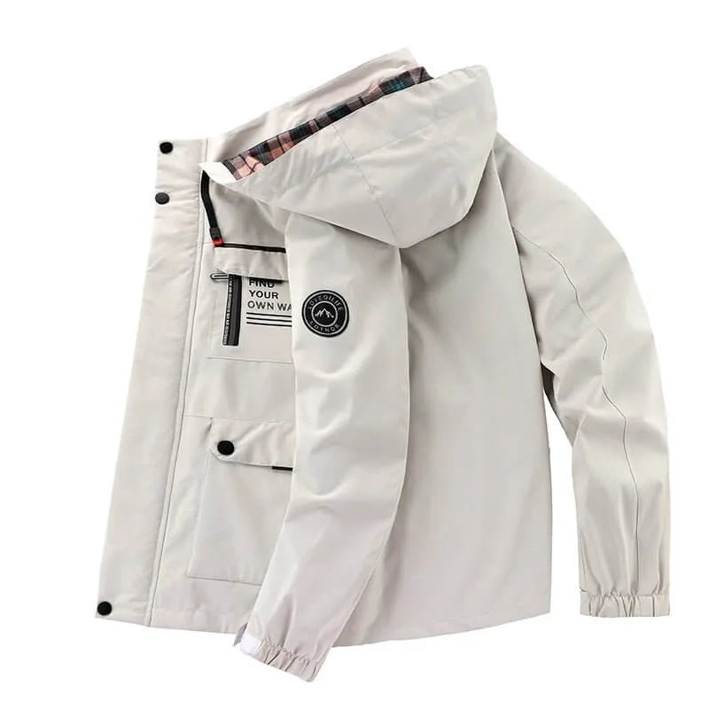 Side profile of the jacket open, showing the zip pocket, flap pockets and arm patch with mountain logo