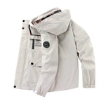 Side profile of the jacket open, showing the zip pocket, flap pockets and arm patch with mountain logo