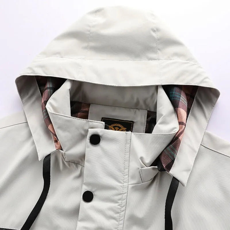 Close-up of the hood and collar with press-stud fastening and checked lining peeking through