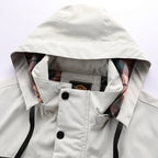 Close-up of the hood and collar with press-stud fastening and checked lining peeking through