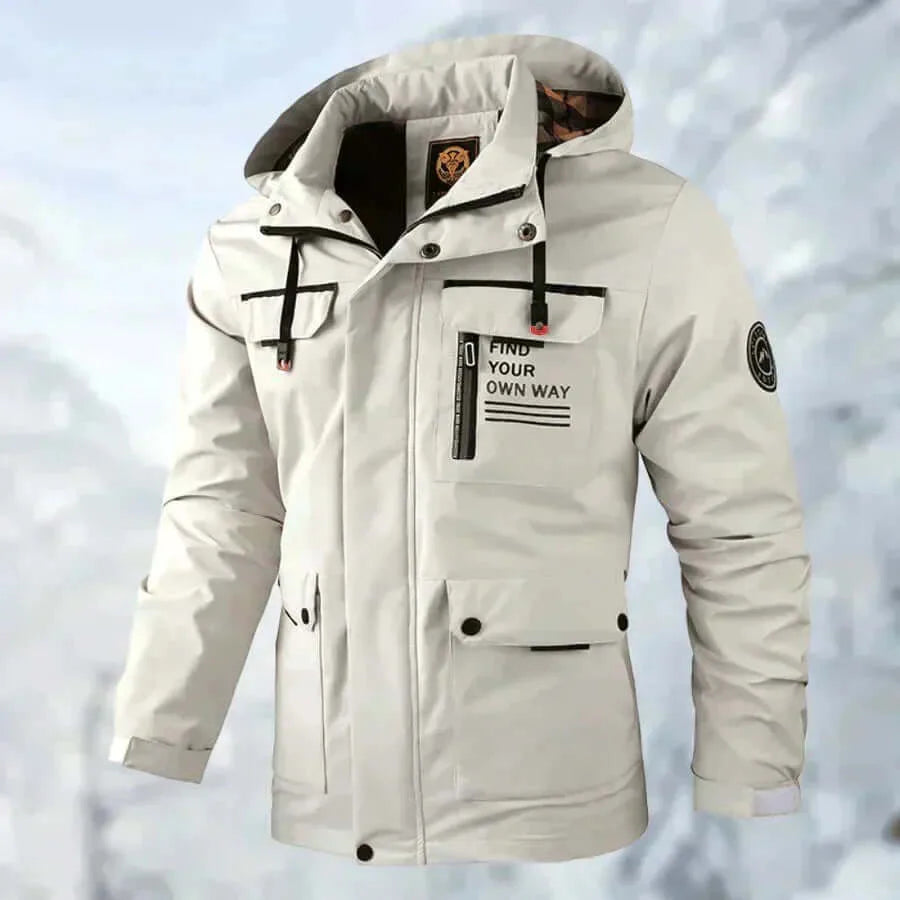 Three-quarter front view of the beige jacket worn, showing cargo-style pockets and hood up