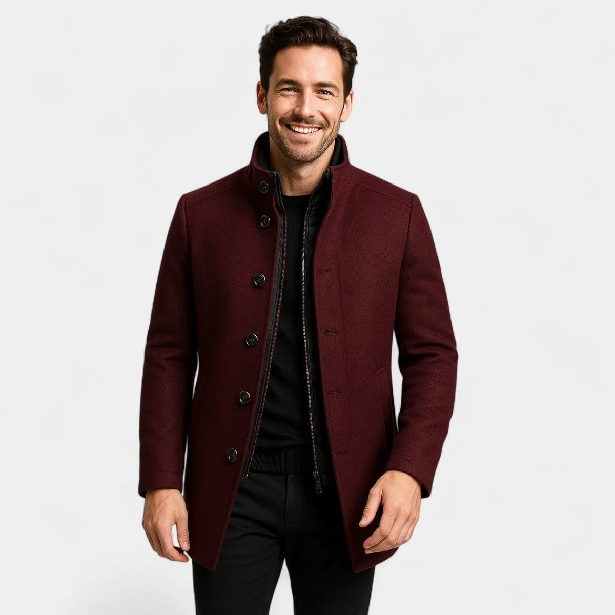 Man wearing a burgundy wool-blend coat open at the front, revealing the black inner gilet and stand-up collar