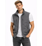 Grey zip-front gilet with stand collar and multiple zip pockets, worn open over a white t-shirt and jeans