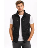 Black zip-up gilet with stand collar and chest zip pockets, worn over a white t-shirt, front close-up view