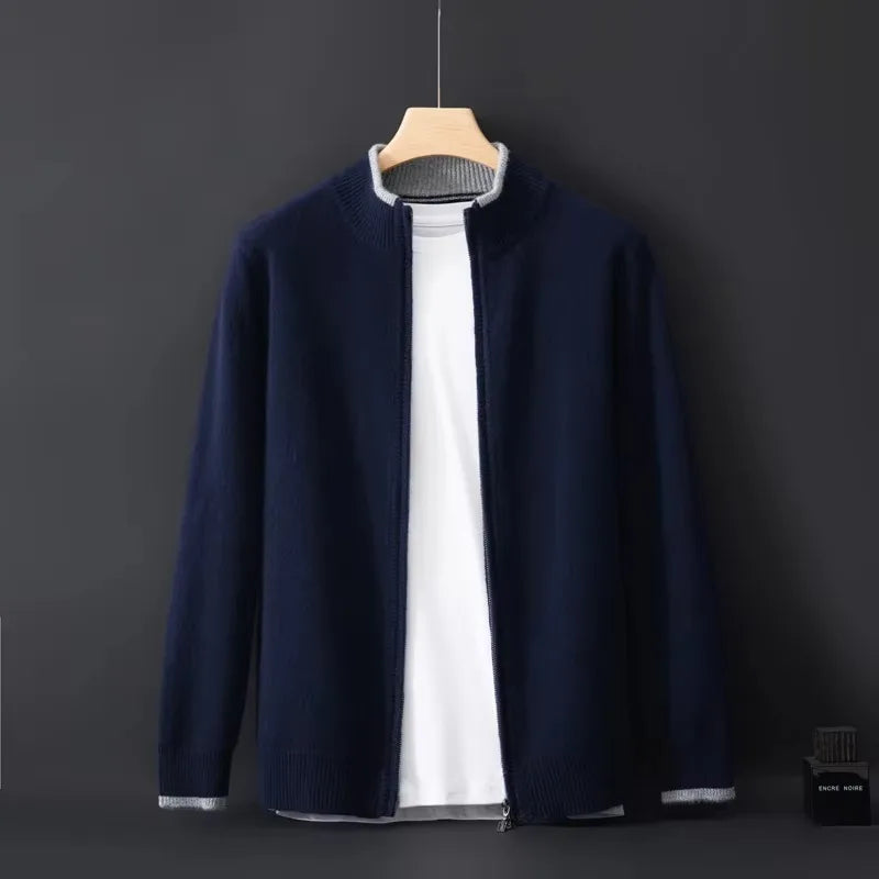 Navy blue cardigan with grey trim collar and cuffs, full front view hanging against dark backdrop