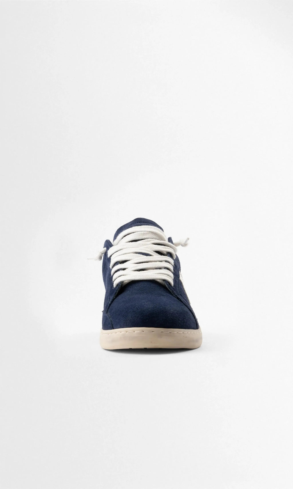 Straight-on front view highlighting the rounded toe box, white laces and cream outsole