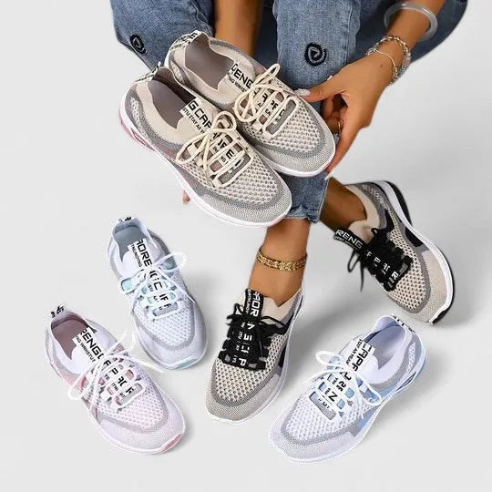 Four colourways of the trainers laid out together in beige, white, grey and pale blue mesh finishes