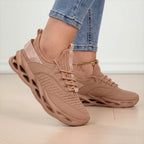 Detail of the lace-up front and ribbed ankle collar on a pink to purple ombre trainer