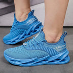 Close-up of the printed text detailing on the side panel of a pink and purple knit trainer