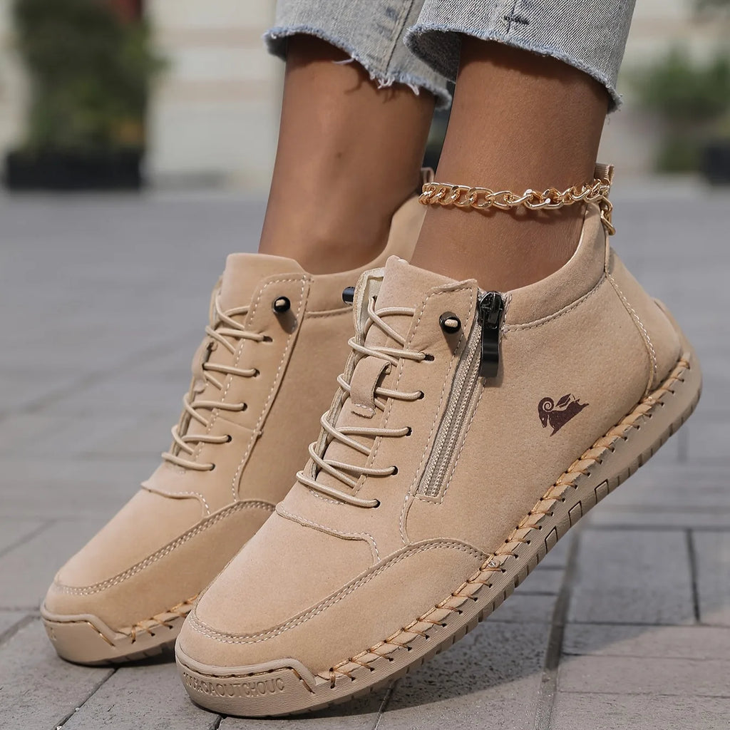 Camel brown leather ankle sneaker shown in motion, revealing the chunky grooved outsole
