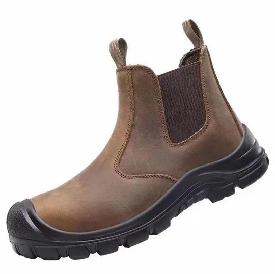 Close-up side profile of a brown leather Chelsea boot with pull loop and stitched panel detailing