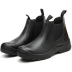 Pair of black leather Chelsea boots viewed from the side, displaying the full silhouette and sole tread