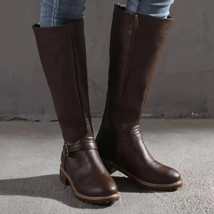 Front angle of dark brown leather knee-high boots showing side zip and stacked block heel