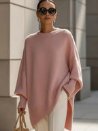 Woman wearing the oversized jumper in soft pink with dropped shoulders and a relaxed silhouette