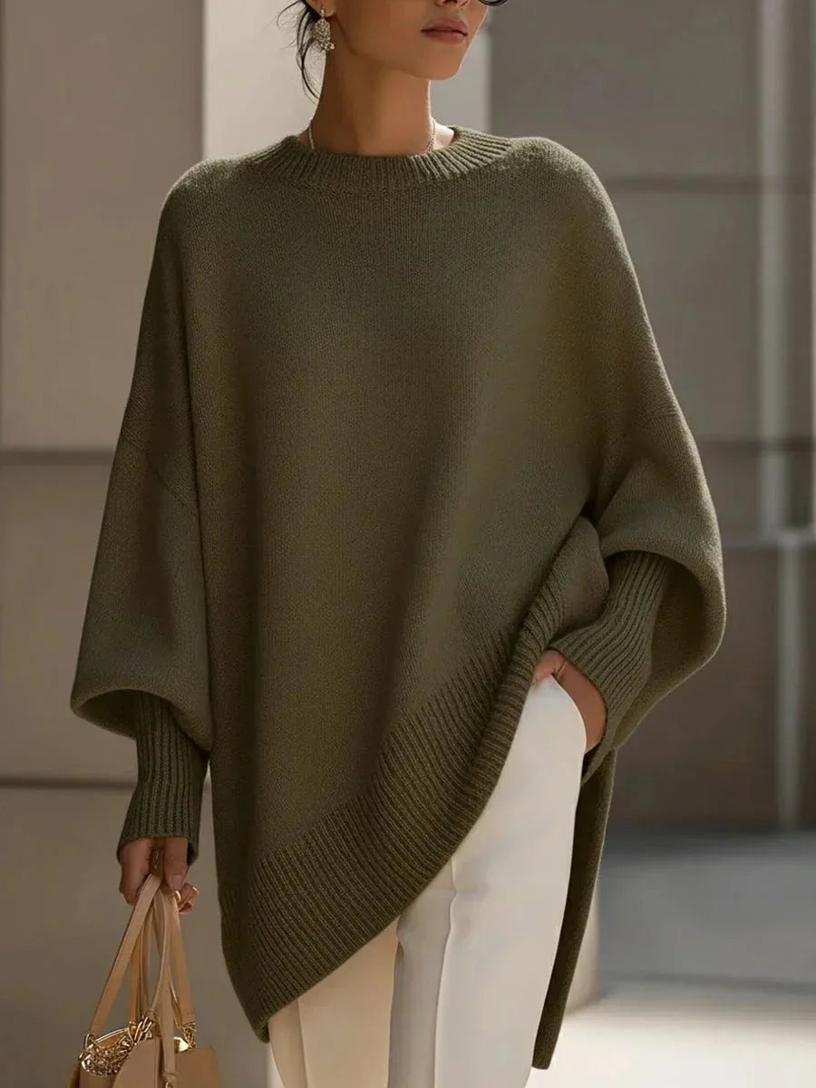 Close-up front view of the black oversized jumper showing the crew neckline and knit stitching detail