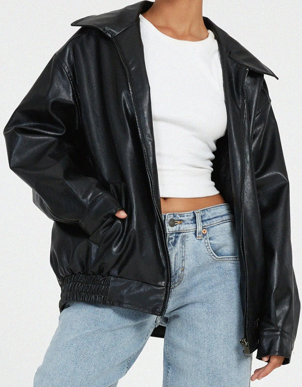 Close-up front view of the black leather jacket showing the zip fastening and wide collar detail