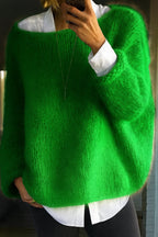 Detail shot of the fuzzy oversized jumper in bright green, styled with a white shirt collar peeking out at the neckline