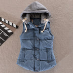 Granite blue padded gilet with grey hood and drawstrings, shown buttoned up on a flat surface