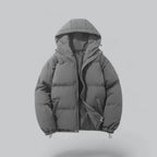 Dark grey quilted hooded jacket with front zip fastening and drawstring hem toggles