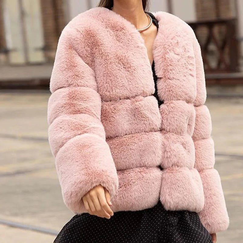 Front-facing view of the cropped pink faux fur puffer jacket showing the high neckline and voluminous sleeves