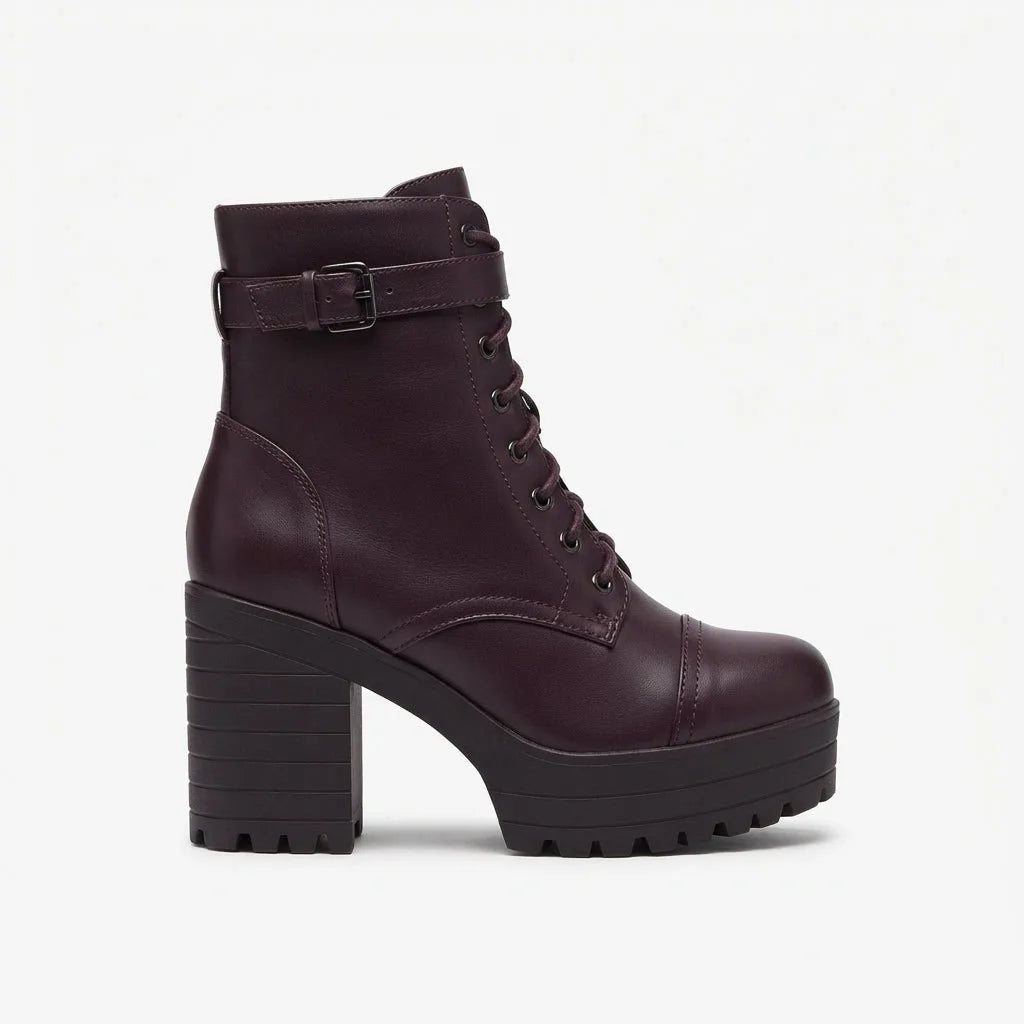 Side profile of a burgundy faux leather lace-up ankle boot with buckle strap and chunky platform block heel