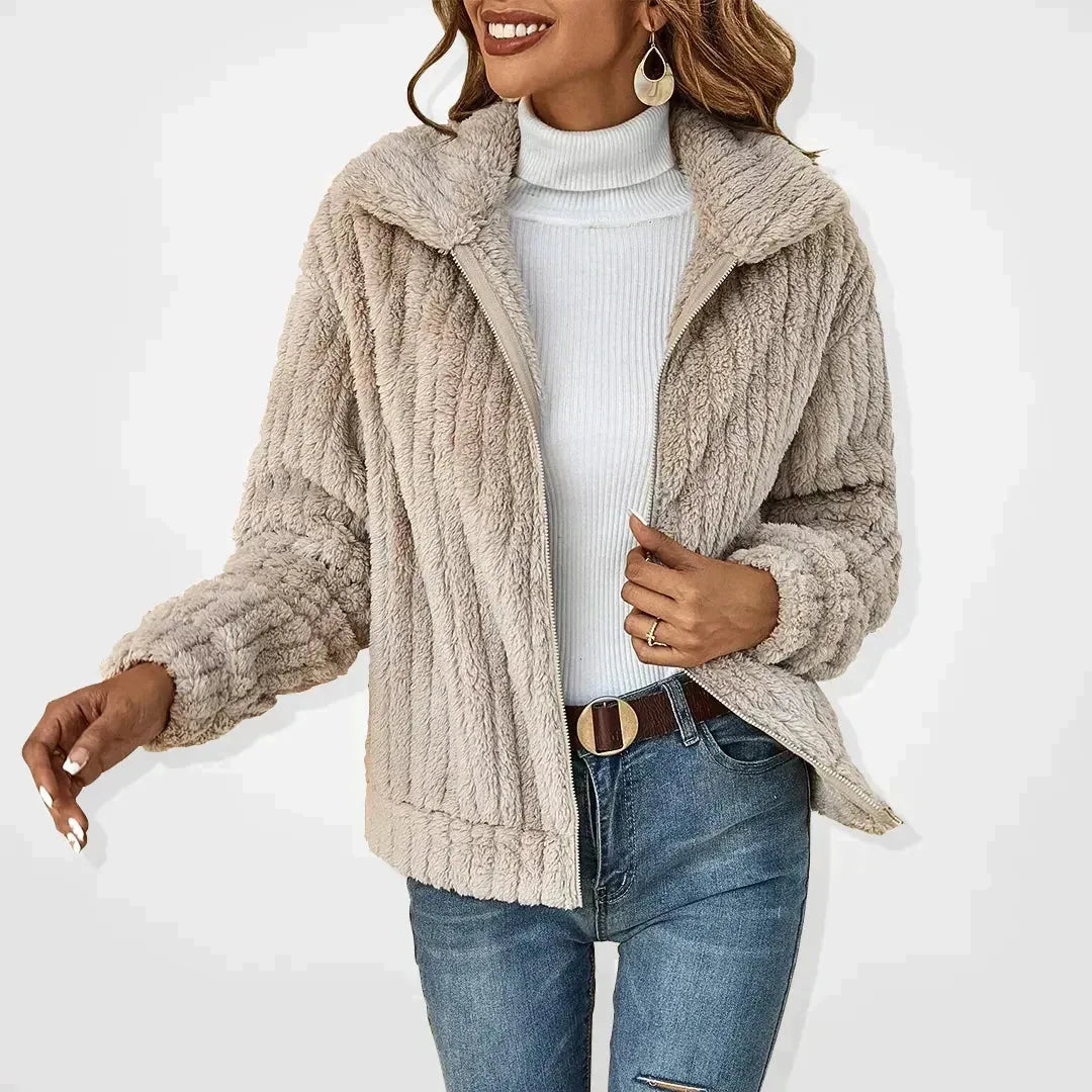 Beige plush ribbed-texture cardigan jacket worn open, close view of the soft fleece fabric and zip front