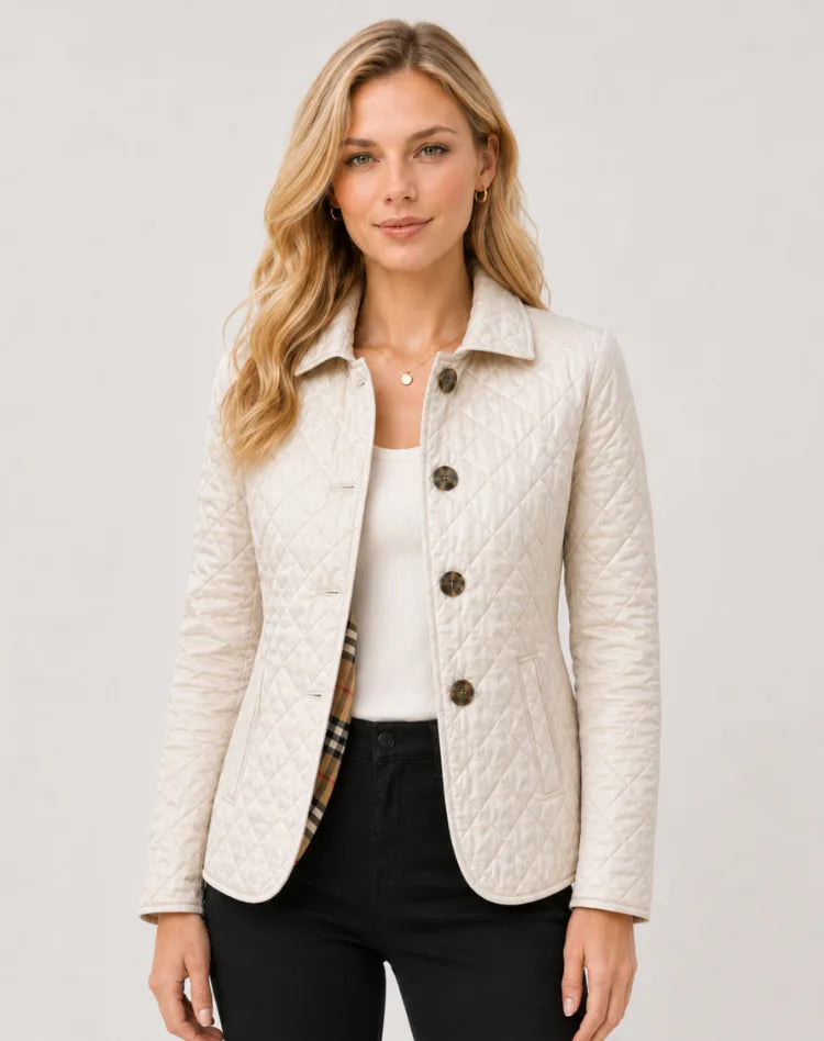 Cream quilted jacket with button fastening and checked lining peeking from the collar and pockets