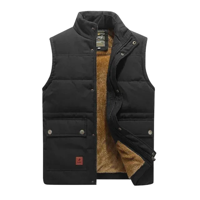 Black padded body warmer with stand collar, front snap buttons and twin flap chest pockets, shown closed