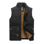 Black padded body warmer with stand collar, front snap buttons and twin flap chest pockets, shown closed