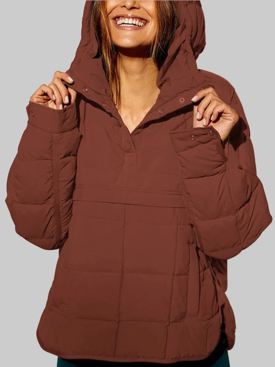 Brown quilted anorak with hood pulled up, snap-fastened collar tabs shown close up