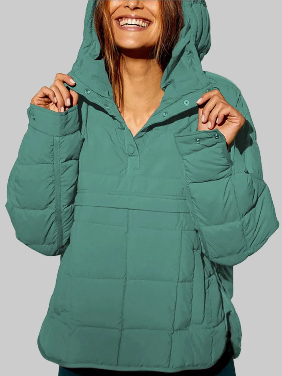 Sage green quilted hooded pullover with hood raised, front snap placket partly open