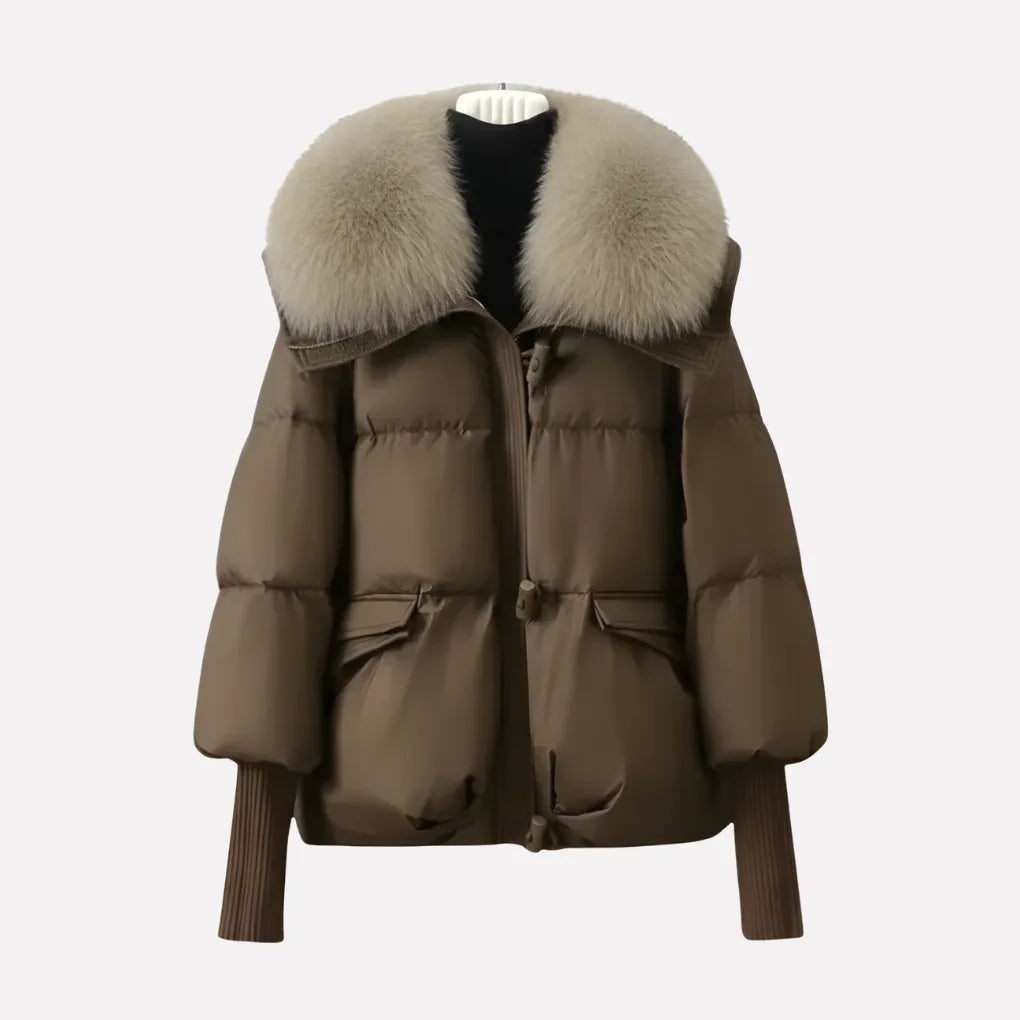 Front view of brown quilted puffer jacket with oversized cream faux fur collar and ribbed cuffs