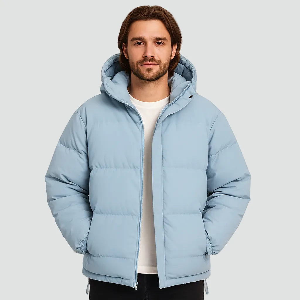 Front view of a man in a light blue hooded puffer jacket worn open over a white t-shirt
