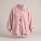 Relaxed-fit knit cardigan in dusty pink with bold gold-tone buttons, shown floating against a plain backdrop