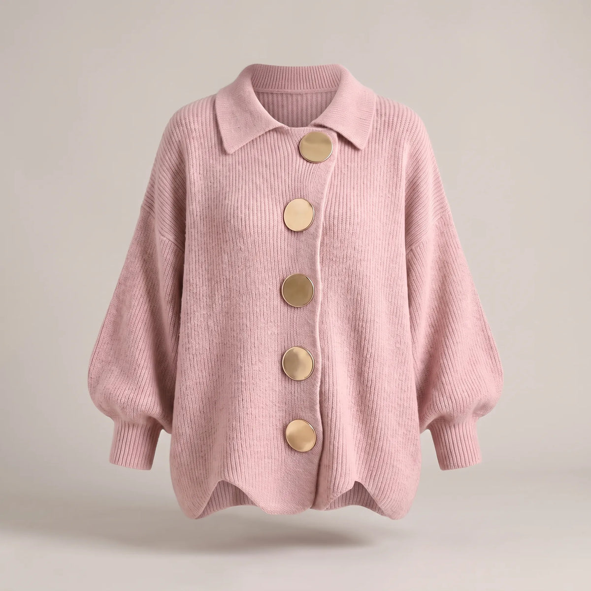 Relaxed-fit knit cardigan in dusty pink with bold gold-tone buttons, shown floating against a plain backdrop