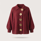 Burgundy ribbed-knit cardigan with five round gold-tone buttons, shown floating against a plain backdrop