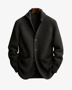 Dark olive ribbed knit blazer-style cardigan shown on a hanger against a plain background