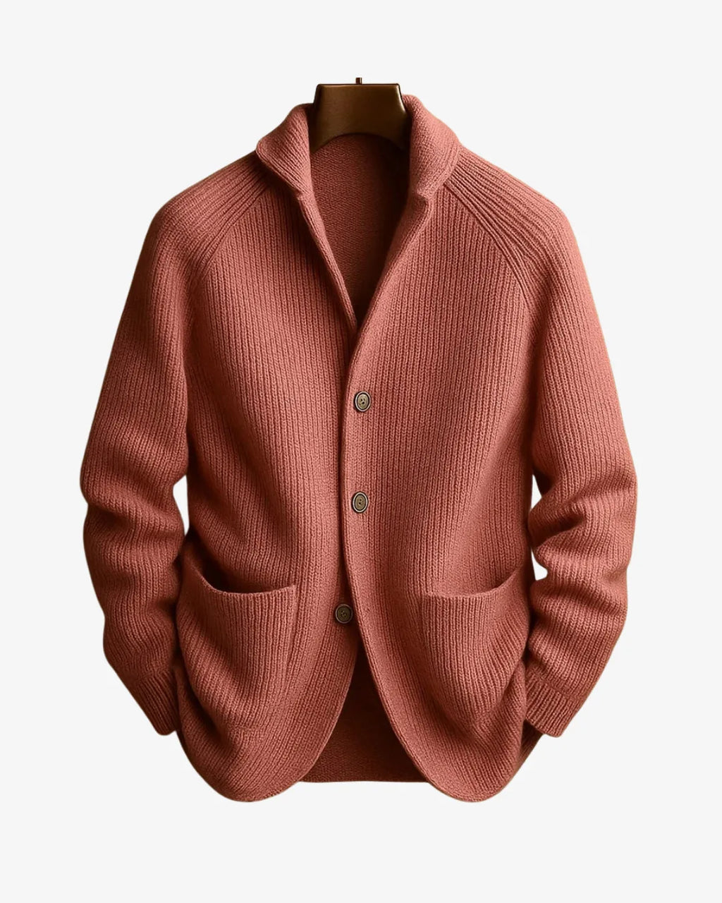 Terracotta pink ribbed knit cardigan with patch pockets and button placket on a hanger