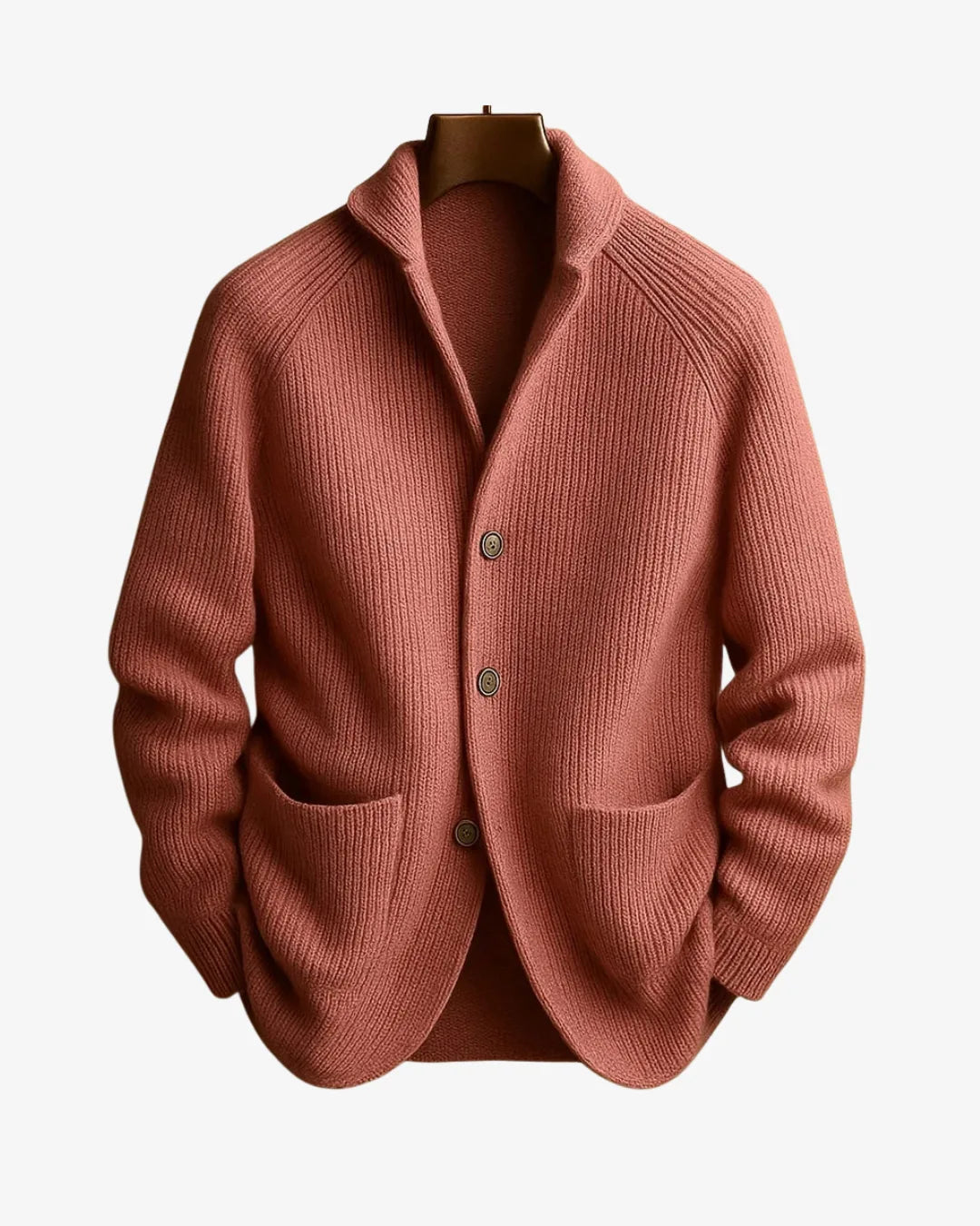 Terracotta pink ribbed knit cardigan with patch pockets and button placket on a hanger