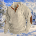 Beige ribbed knit quarter-zip jumper with tan leather button placket and contrast elbow patches, front view