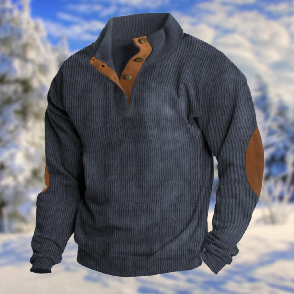 Navy blue ribbed knit jumper with stand collar, leather buttoned placket and tan elbow patches