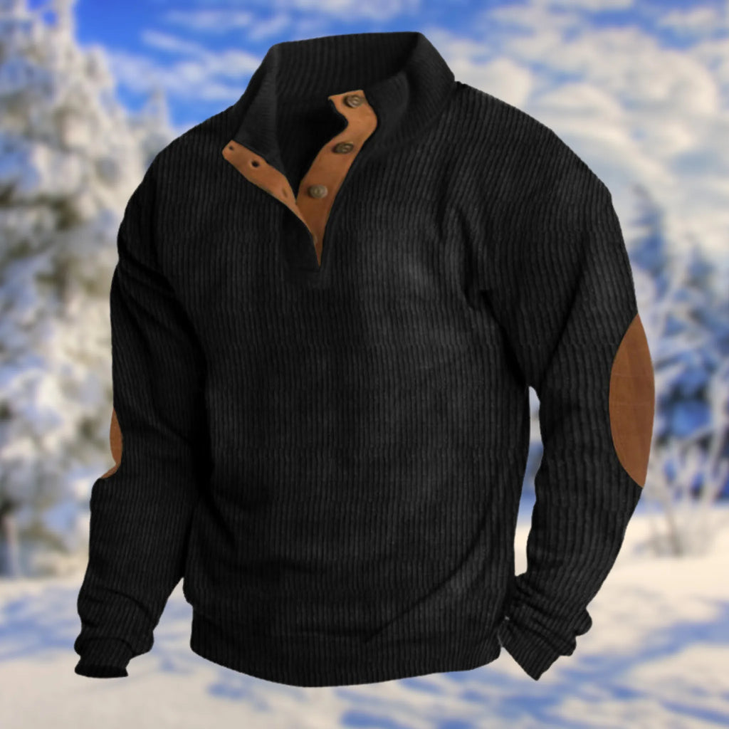 Black ribbed knit jumper with tan leather button placket, stand collar and contrast elbow patches