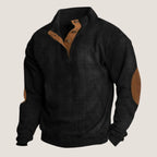 Black ribbed quarter-zip jumper with tan button placket and suede elbow patch detail on sleeve