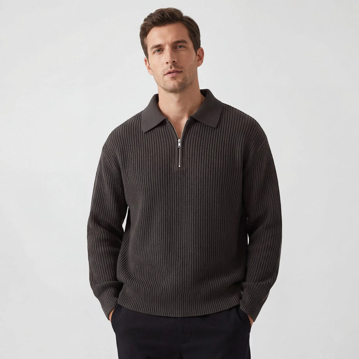 Man wearing a ribbed knit zip polo jumper in dark brown with a collar, front view with zip half undone