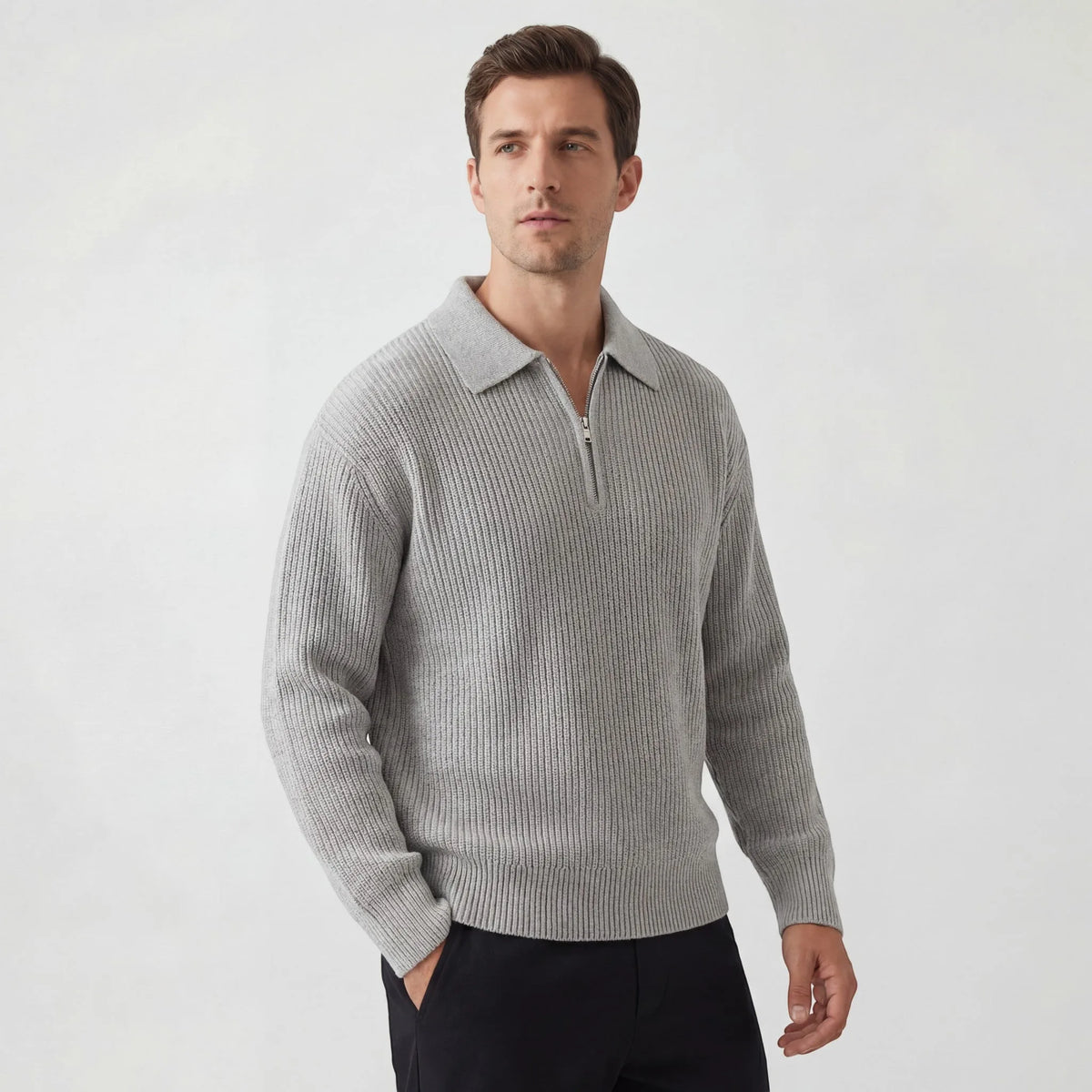 Man wearing a light grey ribbed knit zip polo jumper with contrast collar, front three-quarter view