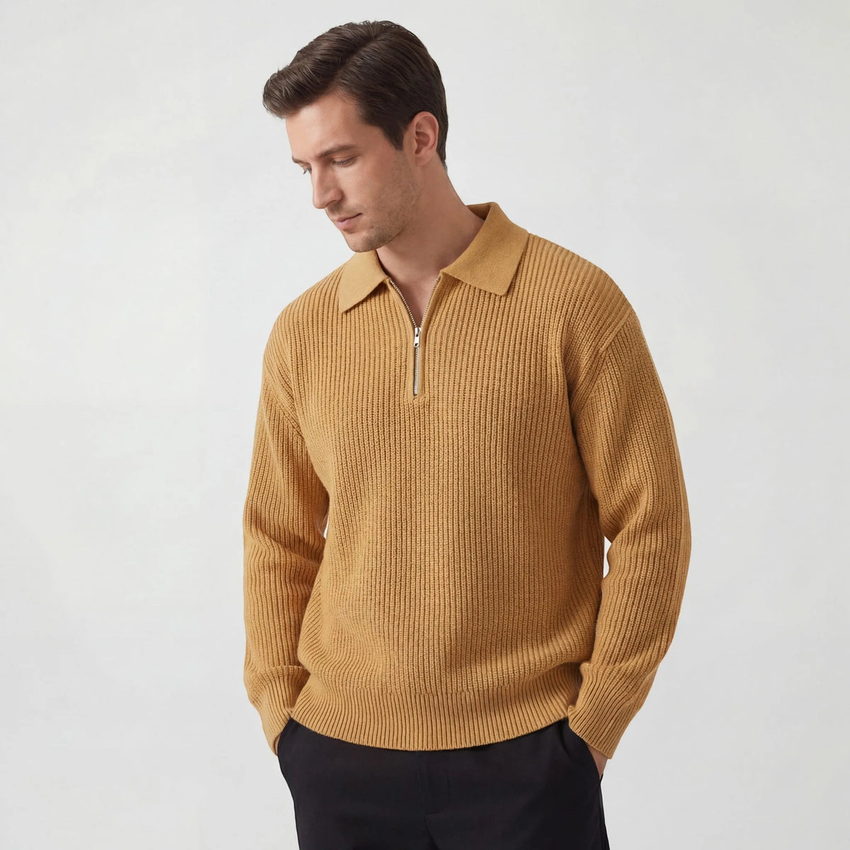 Man wearing a mustard yellow ribbed knit zip polo jumper with matching collar, looking downward