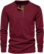 Dark red ribbed long-sleeve henley top with tan button placket and crew neckline, front view