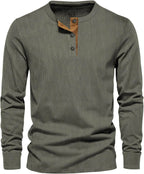 Dark green ribbed long-sleeve henley top with tan button placket, front view on plain background